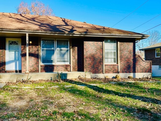 Building Photo - {1809} Spacious Duplex in Great Blue Springs Location + Finished Basement + 1 Car Garage