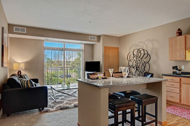 Covington Kitchen Island and Living Room - The Covington Apartment Homes