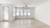 Located at 3420 Legacy Dr in Mount Pleasant, SC, this single-floor residence offers a well-designed layout with one bedroom, one bathroom, and thoughtfully arranged living spaces. The open-concept main area seamlessly integrates the living room, dining area, and kitchen, creating a bright and airy atmosphere enhanced by large windows with plantation-style blinds and a ceiling fan. Light-toned luxury flooring flows throughout the common areas, adding a clean, contemporary feel.

The kitchen is a standout feature, showcasing a spacious quartz-topped center island, dark wood cabinetry with a built-in wine rack, subway tile backsplash, stainless steel appliances, and elegant pendant lighting. It is both functional and visually striking.

The bedroom is a comfortable retreat finished with plush carpeting, a ceiling fan, and multiple windows that invite natural light. Two closets, including a walk-in with wire shelving, provide ample storage.

The full bathroom features a dual-sink vanity with quartz countertops, wood-toned cabinetry, a large framed mirror, and a glass-enclosed walk-in shower. Additional conveniences include a dedicated laundry area and a utility room. The overall design palette of whites and warm wood tones creates a cohesive, modern aesthetic throughout.