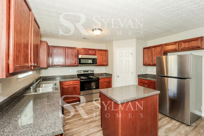 Building Photo - Lease today! No extra charge for contentme...