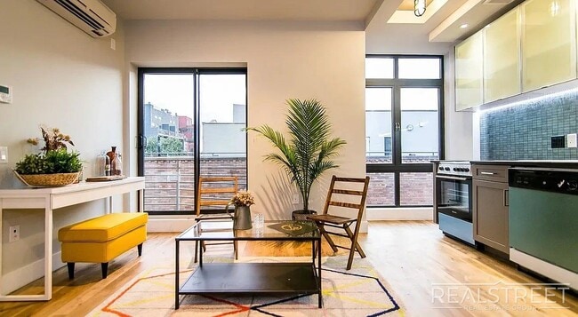 Building Photo - Bright 2 Bed / 1 Bath Loft-Style Residence with Multiple Balconies & Premium Amenities