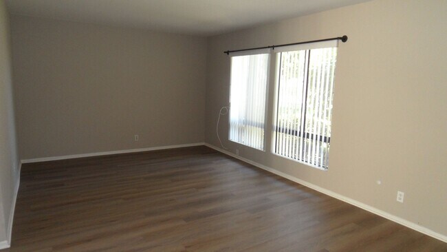 Building Photo - Two Story 4 BR 2.5 BA Condo With 2 Car Garage