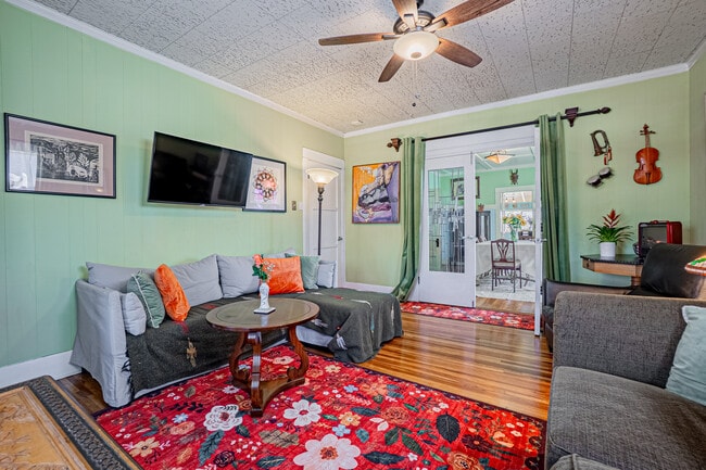 Charming stained-glass French doors connect the living and dining rooms with a warm, inviting flow. - 337 W 16th St