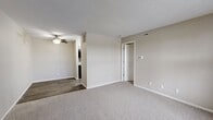 Located at 415 NE Delaware Ave in Ankeny, Iowa, this one-bedroom, one-bathroom unit offers a well-organized, single-floor layout designed for comfortable everyday living. The living room serves as the heart of the space, featuring soft wall-to-wall carpeting, neutral beige walls, and a textured ceiling. A ceiling fan provides overhead lighting and air circulation, while the transition to wood-style flooring in the adjacent area adds a subtle contrast in materials and defines the space naturally.

The bedroom is a comfortably sized retreat with plush carpeting, neutral tones, and a large window that invites natural light and provides views of the surrounding exterior. White trim and clean lines throughout contribute to a bright, cohesive aesthetic. A dedicated closet offers convenient storage directly off the bedroom.

The bathroom is straightforward and functional, featuring a full-size soaking tub with a tub/shower surround, a toilet, and wood-style flooring that complements the rest of the unit. The clean white fixtures stand out against the neutral wall tones, creating a tidy and practical space.

Overall, the unit maintains a consistent palette of warm neutrals and clean whites, offering a move-in-ready environment that is easy to personalize. The efficient layout makes practical use of every area, making this a solid and well-appointed living space in Ankeny.