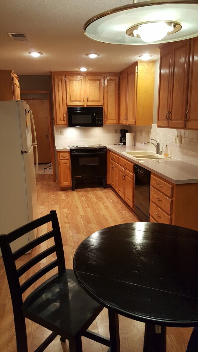 Kitchen from door to private deck toward door to garage - 4519 Bell St
