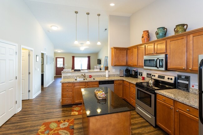 Spacious Kitchens with Breakfast Bar and Room for a Table - Redwood Wolverine Lake