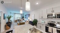 This thoughtfully designed one-bedroom, one-bathroom residence in Durham, NC offers a well-appointed open-concept layout that maximizes every square foot. The kitchen is a standout feature, showcasing granite countertops, crisp white shaker cabinetry with matte black hardware, a central island with pendant lighting overhead, and a full suite of stainless steel appliances including a French door refrigerator, electric range, and built-in microwave. Light wood-style flooring flows seamlessly from the kitchen into the living area, which is bathed in natural light from large windows with views of the surrounding neighborhood. The living room provides a comfortable and versatile space, well-suited for both relaxation and a dedicated workspace. The bedroom is generously proportioned, featuring a ceiling fan, large windows with blinds and sheer curtains, and a closet. The bathroom continues the home's refined aesthetic with granite-topped vanity cabinetry, a large mirror, and modern fixtures. A hallway with additional storage completes the floorplan. Throughout the residence, neutral tones, recessed lighting, and consistent finishes create a clean, modern ambiance that is both functional and inviting.