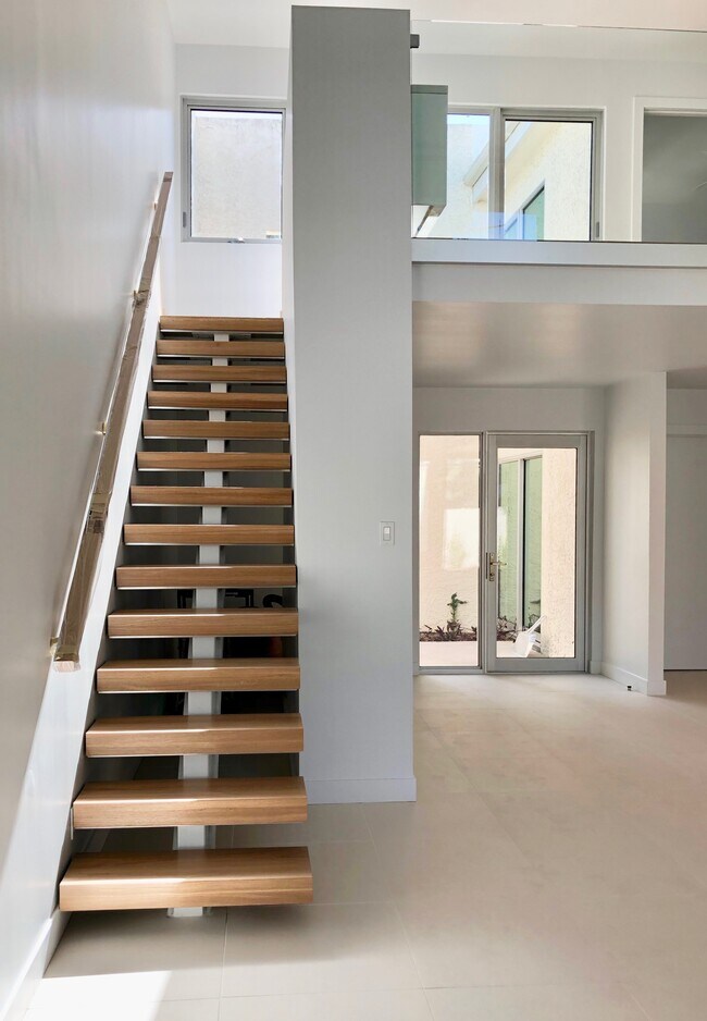 Beautiful open wood stair takes you to the second floor here you'll find the master bedroom suite and third bedroom - 4636 40th St