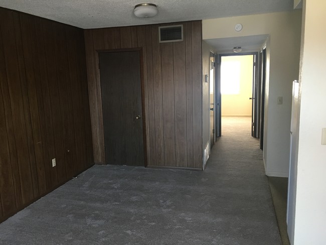 Living room looking down hallway to bedroom - 801 S Main St