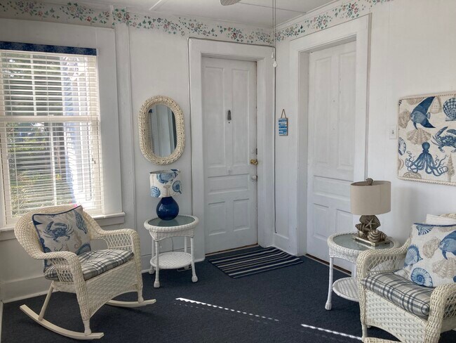Shared porch-with wicker chairs and loveseat - 317 Eagle St