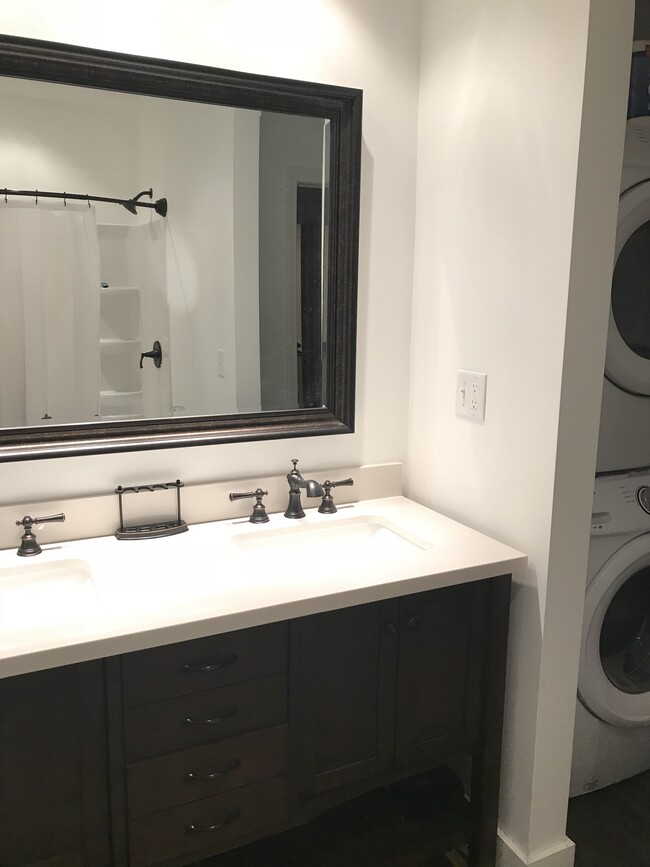 Bronzed accented sink faucets and handles combined with heavy duty dark espresso color wood. - 43 Front St