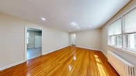 Located at 33 Warren Street in Nutley, NJ, this 1-bedroom, 1-bathroom unit offers a thoughtfully designed single-floor layout that maximizes every square foot. Rich, honey-toned hardwood floors run throughout the living areas and bedroom, lending warmth and continuity to the space. The open living room is bright and inviting, featuring recessed lighting and a classic arched doorway that adds a touch of architectural character. Natural light filters in through multiple windows, complemented by classic white cast-iron radiators that evoke a timeless aesthetic. The spacious primary bedroom offers a window with outdoor views, a closet, and the same gleaming hardwood flooring. With four closets total throughout the unit, storage is plentiful. The kitchen is equipped with a gas range, refrigerator, and cabinetry in a light gray finish, along with a window that brings in natural light. The bathroom features clean white subway tile surrounding the bathtub and shower, a white vanity with chrome hardware, and a bright window that enhances the crisp, airy feel. Neutral wall tones throughout create a clean, move-in-ready canvas well-suited for a variety of interior styles.