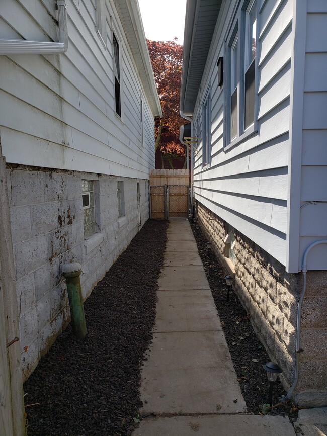 Pathway to Apartment around back of the house - 3132 N Weil St