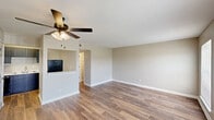 Located at 3708 Garden Oaks Dr in New Orleans, LA, this single-story, 3-bedroom, 1-bathroom home offers a practical and well-organized layout. The combined kitchen and living area serves as the heart of the home, featuring wood-look plank flooring, neutral-toned walls, and a ceiling fan with light fixture. The kitchen is equipped with dark cabinetry, marble-look countertops, and stainless steel appliances, including a full-size refrigerator. A half-wall partition visually separates the kitchen from the open living space.

The three bedrooms are carpeted and share a consistent neutral color palette, each featuring windows with blinds that allow natural light and outdoor views. The primary bedroom includes dual windows overlooking the surrounding greenery, while the additional bedrooms each offer a window and built-in closet storage. White six-panel doors are used consistently throughout, adding a clean, cohesive aesthetic.

A central hallway connects the bedrooms to the shared bathroom, which includes a soaking tub, toilet, and vanity with a marble-look countertop. The bathroom features wood-look flooring that ties into the rest of the home. Overall, the space maintains a clean, move-in-ready feel with a neutral, functional design throughout.