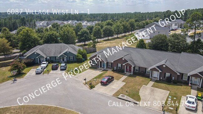 Building Photo - 6087 Village W Ln