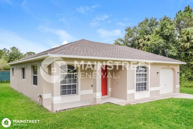 Foto del edificio - 1016 Bagget St E, Lehigh Acres, FL 33974