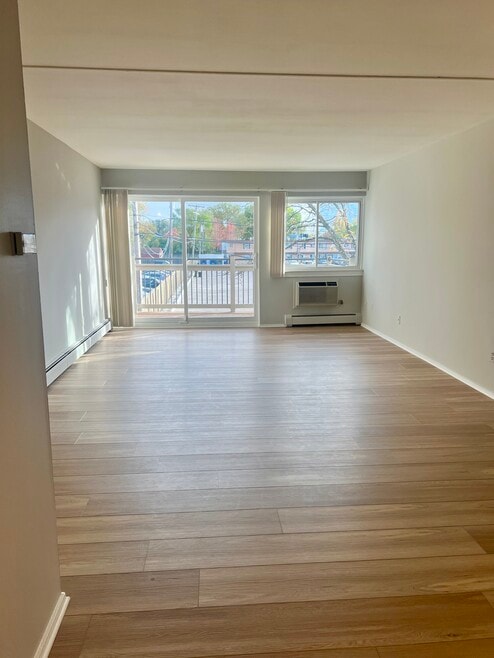 2BR, 1BA - 1,025SF - Living Room - Camelot Apartments