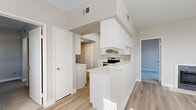 Located at 150 S Roosevelt Rd in Mesa, Arizona, this single-floor, 3-bedroom, 2-bathroom home offers an efficient and thoughtfully arranged layout. The living room serves as a welcoming centerpiece, featuring a tile-surround fireplace and light wood-style flooring, with a glazed exterior door that invites natural light and outdoor access. Two windows brighten the space, enhancing its open, airy feel.

The kitchen is clean and modern, outfitted with crisp white shaker cabinetry, white quartz countertops, a stainless steel electric range, and a peninsula that provides additional workspace and a natural division between the kitchen and living areas. Light wood-style flooring continues throughout the main living spaces.

The primary bedroom is a comfortable, carpeted retreat with direct access to one of the two bathrooms, which features a full tub/shower combination and a white vanity. The additional bedrooms are also carpeted, with one offering a built-in closet and a window overlooking the exterior. Both bathrooms are clean and functional, each with a tub/shower surround and updated fixtures.

A hallway connects the bedrooms and bathrooms, and a dedicated closet provides useful storage. The neutral color palette and updated finishes throughout create a bright, cohesive atmosphere well-suited to everyday living.
