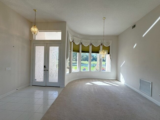 Building Photo - 4/3 Pool Home in Pelican Bay