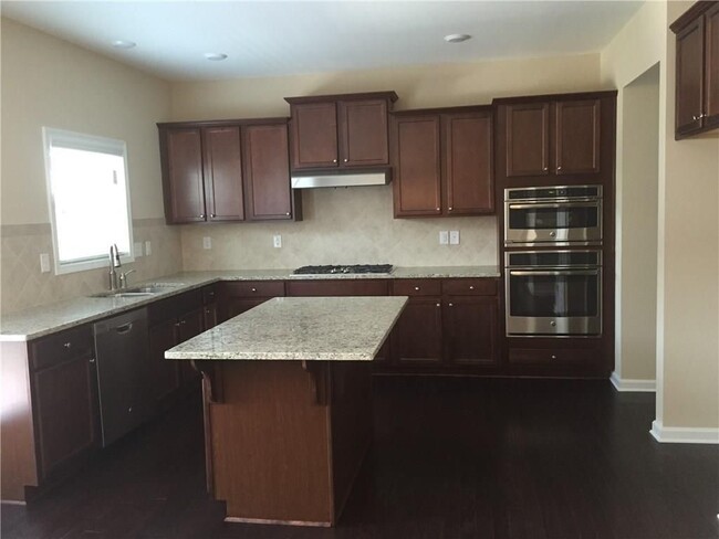 Kitchen with center island - 812 Ivy Vine Way