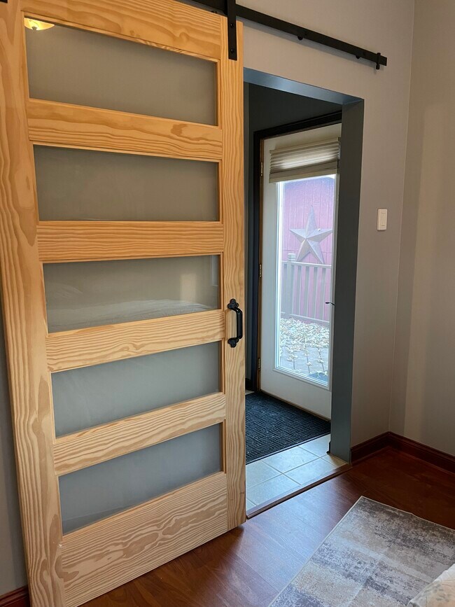 Sliding barn door for bedroom downstairs. - 438 E 7th St