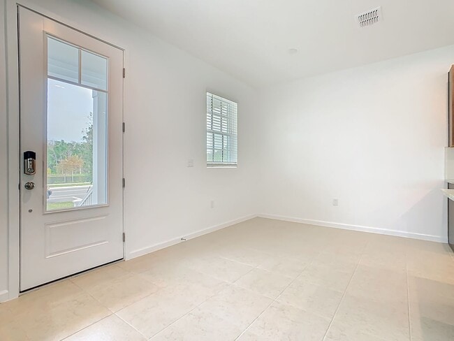 Building Photo - New Luxury Townhome in Celebration, FL Corner unit.  All porcelain tiled floors.  Aleutian model ...
