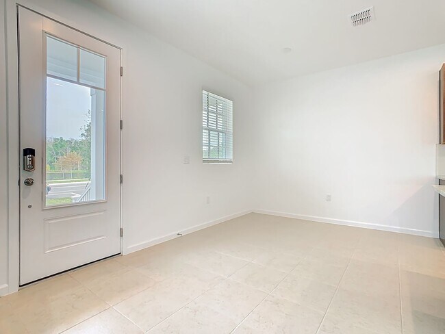 Foto del edificio - New Luxury Townhome in Celebration, FL Corner unit.  All porcelain tiled floors.  Aleutian model ...