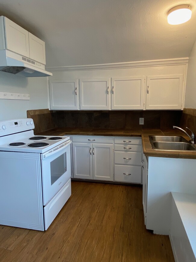 Stone tile counters and plenty of cabinet space - 3735 Fawcett Ave