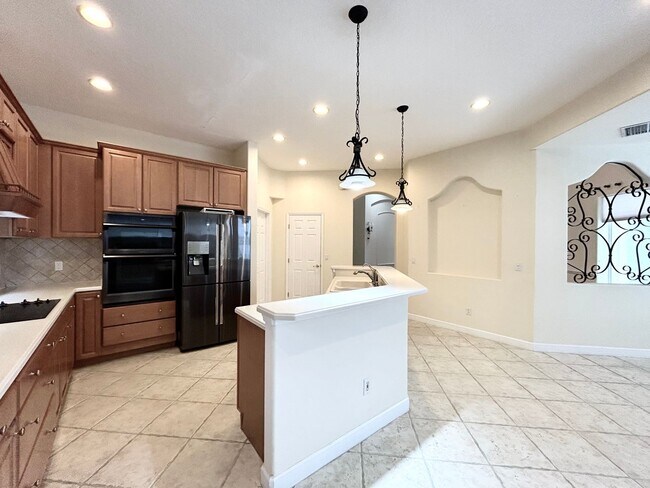 Building Photo - Luxurious 4/3 Stunning Pool Home with a Go...