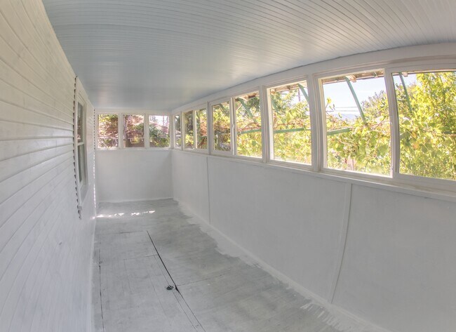 Back pourch prior to the floor being painted. Amazing air flow with over 13 windows - hardly ever need brand new air system. - 127 1/2 Keystone Ave