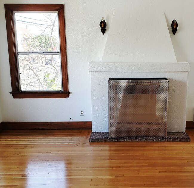 Mock fireplace w heater screen and sconces - 1620 E 4th St