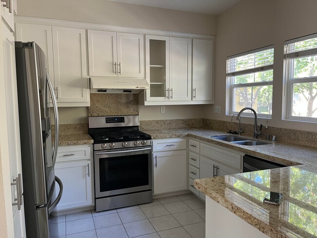 Kitchen with granite countertop - 3595 Madison Cmn
