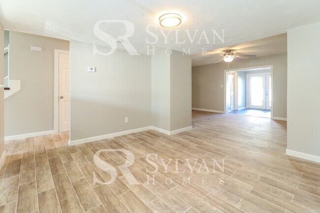 Building Photo - Venture outside to the expansive backyard,...