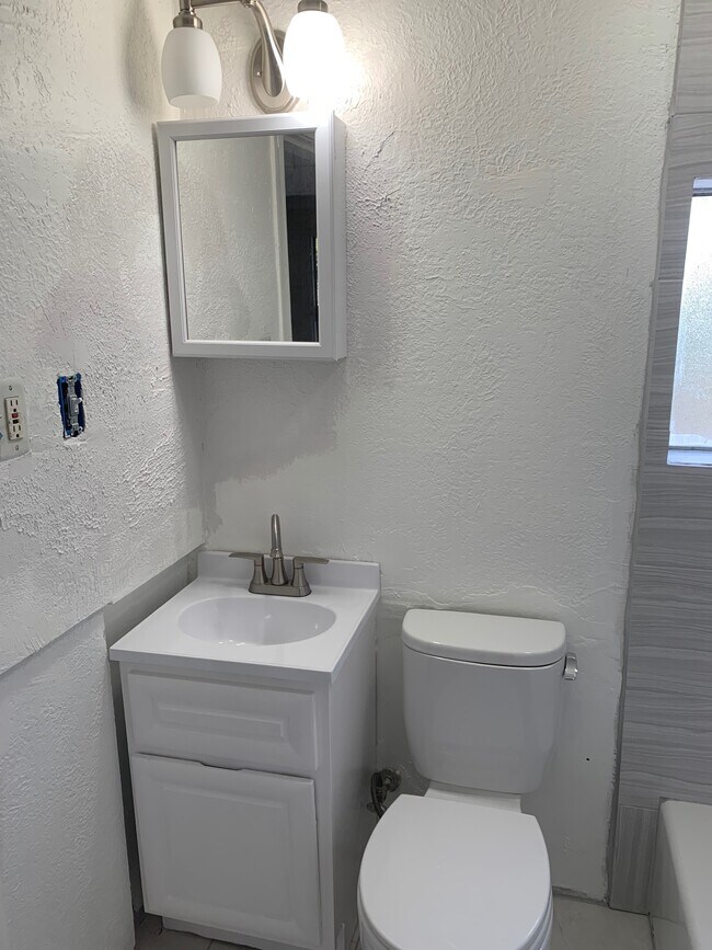New vanity and light - 3092 King St