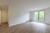 This well-appointed one-bedroom, one-bathroom unit at 420 Central Ave in London, Ontario offers a clean, modern aesthetic throughout. Light-toned hardwood-style flooring flows seamlessly across the entire space, complementing the crisp white walls and creating a bright, cohesive feel.

The open-concept kitchen and living area is a functional centerpiece of the unit. The kitchen is outfitted with white shaker-style cabinetry, a classic subway tile backsplash, dark countertops, and a full suite of stainless steel appliances including a range, microwave, and dishwasher. The living room benefits from large sliding glass doors that open to a private balcony, flooding the space with natural light and offering pleasant views of surrounding greenery.

The bedroom is a comfortable and well-lit retreat, featuring a window with tree-lined views, a built-in double closet for ample storage, and baseboard heating. The bathroom is finished in a clean, contemporary style with a white vanity, undermount sink, chrome fixtures, and a well-lit mirror. Baseboard heating is present throughout the unit, ensuring year-round comfort. The overall ambiance is light, airy, and move-in ready, with thoughtful modern finishes that make efficient use of the available space.