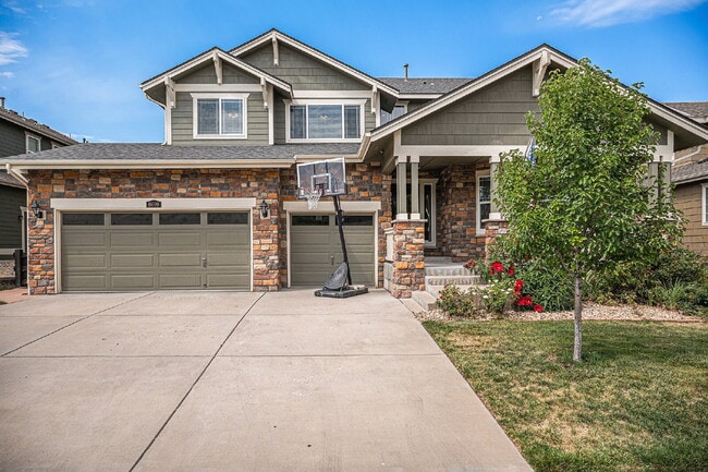 Photo - "Spacious 4-Bed Oasis with Granite & Hardwood Elegance at 8699 S Addison Way!" Apartment