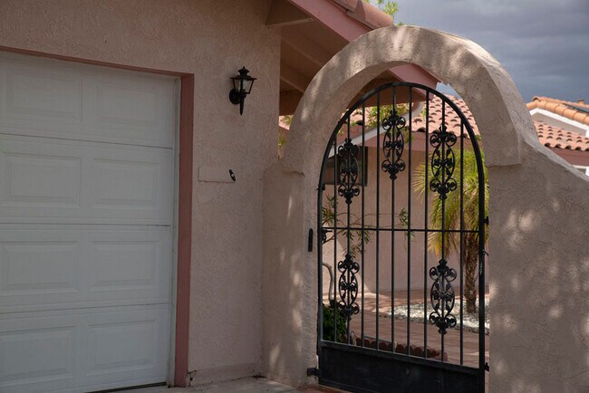Doorbell at arched gate - 12366 E Paseo Verano