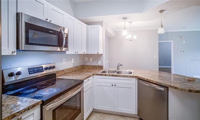 Building Photo - Free application fees 2 Bedroom condo with 2 Baths and balcony minutes from The Mall at Millenia