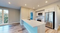 This contemporary apartment, located at Lakeside Dr, C310, Sunnyvale, CA, offers a thoughtfully designed living space of 1160 square feet. The single-story layout comprises 2 bedrooms, including a generous 150 square foot primary bedroom, and 3 bathrooms. The heart of the home is an open-concept kitchen and living room, perfect for entertaining or relaxing.

Large windows throughout flood the space with natural light, offering views of the surrounding area and creating an airy atmosphere. The modern kitchen features sleek white cabinetry, stainless steel appliances, and a functional island with a sink, providing ample workspace and casual seating.

The bathrooms are elegantly appointed with double vanities, modern fixtures, and glass-enclosed showers. Storage is abundant, with a walk-in closet and additional built-in closet space in the bedrooms. The apartment boasts high-quality finishes, including durable wood-look flooring throughout and neutral-toned walls.

A standout feature is the private balcony accessible from the kitchen, offering outdoor space for relaxation or al fresco dining. The apartment's layout includes two hallways for easy navigation, ensuring a sense of privacy between living and sleeping areas. This well-designed space combines functionality with contemporary style, creating an inviting urban retreat.