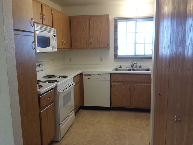 Kitchen with Pantry and Window - Oklahoma Park Townhomes