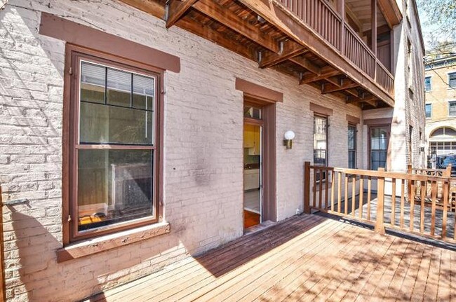 Entryway from deck. There is a permanent light on the wall as well as an outdoor outlet. - 505 Milton St