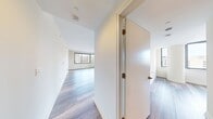 This contemporary apartment at Eleven55 Ripley offers 880 square feet of thoughtfully designed living space. The open-concept floor plan seamlessly integrates the kitchen, living, and dining areas, creating a spacious feel. The kitchen boasts modern wood-grain cabinetry, sleek stainless steel appliances, and a convenient island with additional seating.

Both bedrooms are generously sized, with the primary bedroom measuring 140 square feet. Large windows in the living areas and bedrooms flood the space with natural light and provide stunning views of the surrounding cityscape. The two full bathrooms feature modern fixtures, including a combination tub/shower in one and a walk-in shower in the other.

Throughout the apartment, you'll find high-quality finishes such as wood-look flooring and neutral color schemes. The unit also includes ample closet space and in-unit laundry for added convenience. With its central location and modern amenities, this apartment offers a perfect blend of style and functionality for urban living.