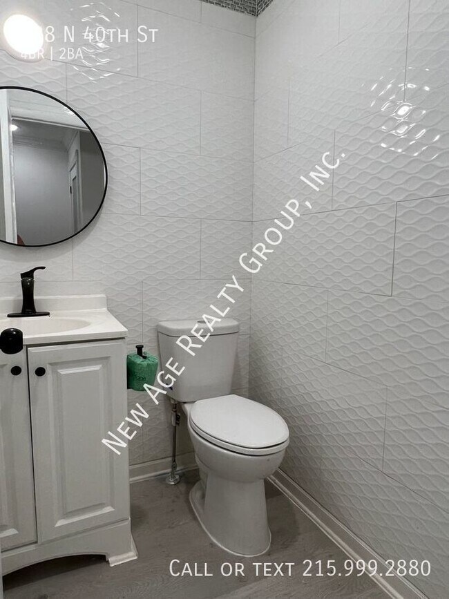 Foto del edificio - Four Bedroom, Bi-level Apartment in Belmon...