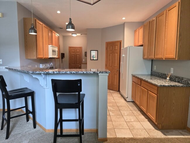 Building Photo - 9649 Peony Ln N