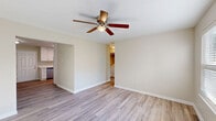 This recently updated single-story home in Gastonia, NC offers 760 square feet of efficient living space. The property features three bedrooms, including a primary bedroom of 140 square feet, and one full bathroom. The open-concept layout showcases a modern kitchen with white cabinetry, stainless steel appliances, and ample counter space. The living room is spacious and filled with natural light, complemented by a ceiling fan for comfort. Throughout the home, newly installed hardwood floors create a cohesive and contemporary feel. The bathroom is equipped with a shower/tub combination and updated fixtures. For convenience, the property includes an in-unit laundry area with a washer and dryer. Each bedroom is well-proportioned and features a ceiling fan, with the primary bedroom offering additional space. The neutral color palette and abundance of windows contribute to a bright and airy atmosphere throughout the residence. This compact yet functional home is ideal for those seeking a modern living space with all essential amenities.