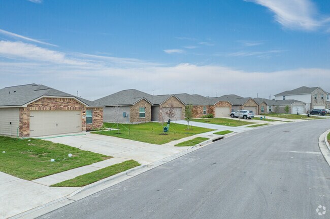 Jarrell's charming community with homes boasting timeless brick and stone facades.