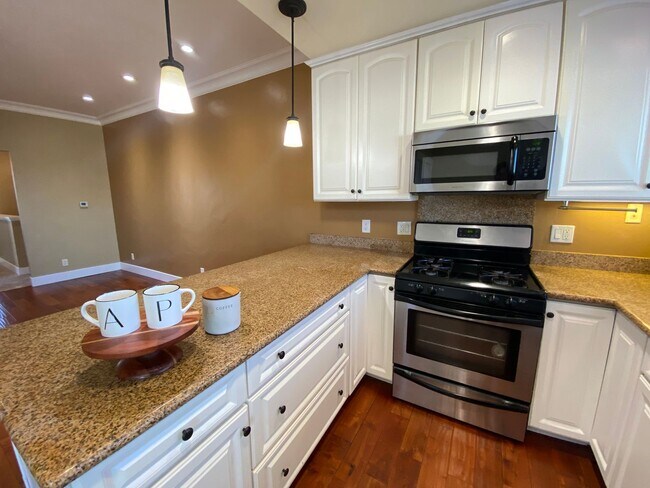 Building Photo - Advent- Top Floor Condo W/ In Unit Laundry...