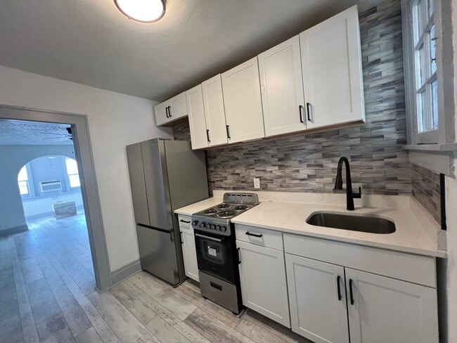 Kitchen with stainless steel appliances - 669 Avenue B NW