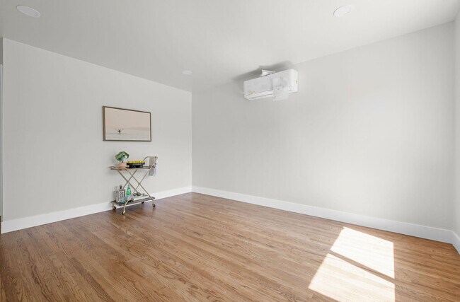 Living room with new paint, flooring, ac/heat - 9211 Earl St