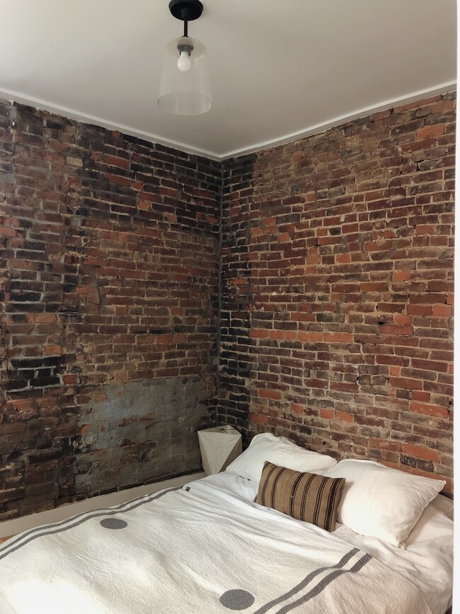 Exposed brick bedroom - 1713 Locust St